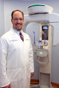 Dr. Toback next to machine